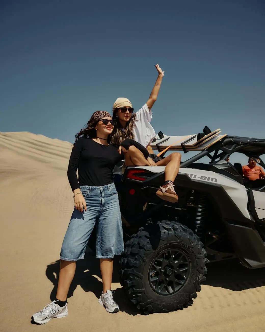 two friends enjoying an atv adventure in the desert