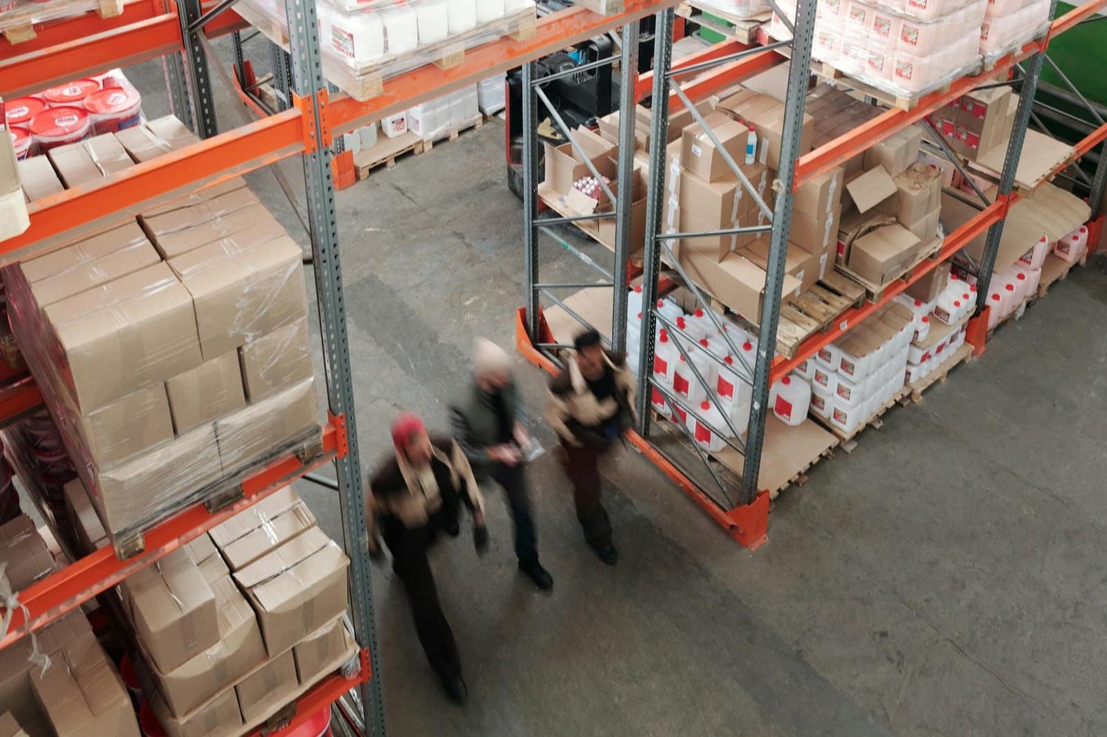 men walking in a warehouse
