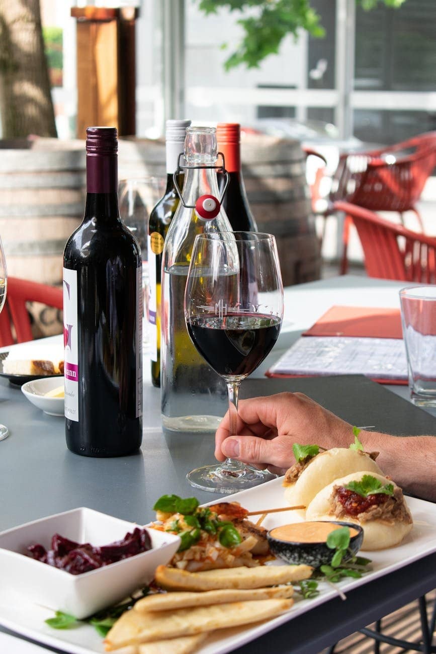 wine bottles beside wine glass